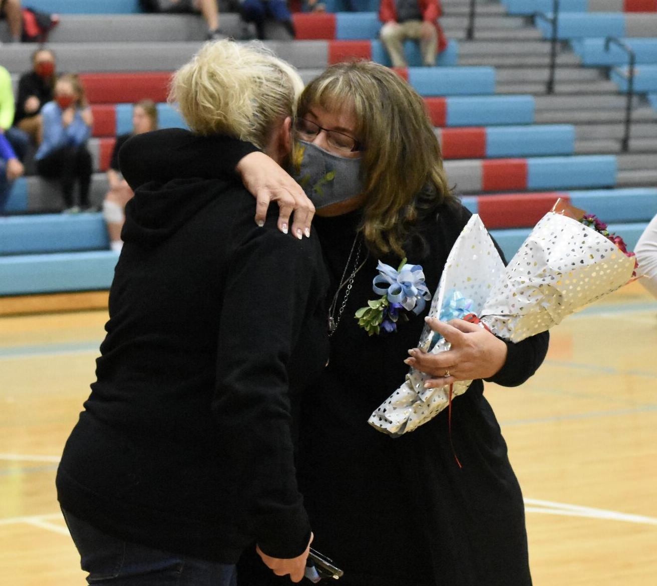 Sherry Hooks and Wendy Ratliff share a hug